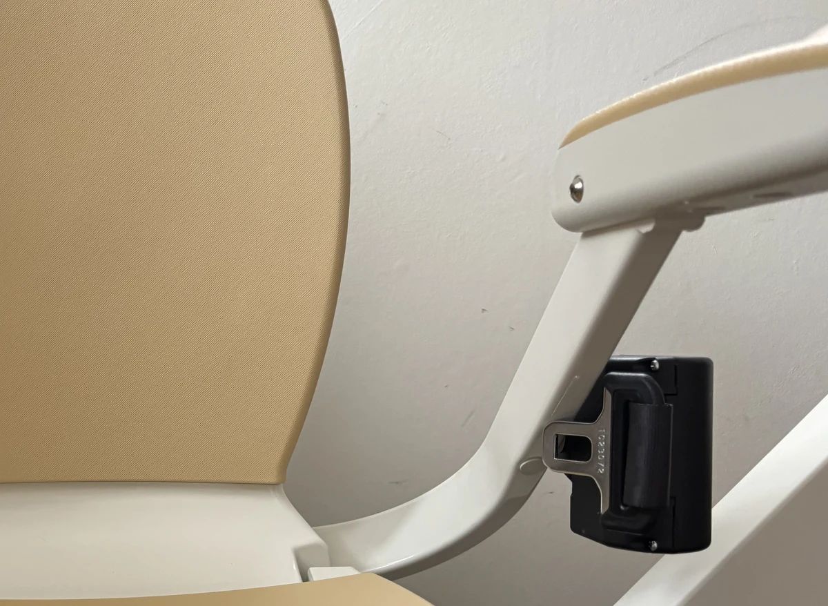 Close-up of the joystick control on the end of a stairlift armrest